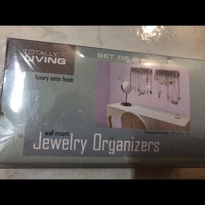 ONE jewelry organizer (hangs on wall)